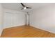 Bedroom featuring hardwood floors, a ceiling fan and a double-door closet at 1445 Monroe Ne Dr # B7, Atlanta, GA 30324