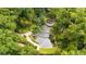 Aerial shot of tiered water feature surrounded by lush greenery and winding pathways in beautiful botanical gardens at 1445 Monroe Ne Dr # B7, Atlanta, GA 30324