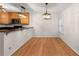 Cozy breakfast nook with hardwood floors and modern light fixture at 1445 Monroe Ne Dr # B7, Atlanta, GA 30324