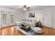 Bright living room featuring hardwood floors, a ceiling fan, and neutral decor at 1445 Monroe Ne Dr # B7, Atlanta, GA 30324