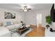 Inviting living room featuring a ceiling fan, hardwood floors, and neutral wall color at 1445 Monroe Ne Dr # B7, Atlanta, GA 30324