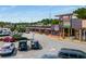 A bustling shopping center with a variety of stores, ample parking, and a vibrant atmosphere for shoppers at 1445 Monroe Ne Dr # B7, Atlanta, GA 30324