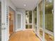 Bright sunroom with wood floors and views of backyard at 1445 Monroe Ne Dr # B7, Atlanta, GA 30324