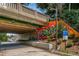 View of a concrete underpass with colorful graffiti, providing a unique urban aesthetic and pedestrian access at 1445 Monroe Ne Dr # B7, Atlanta, GA 30324