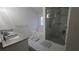 Main bathroom with double vanity and glass shower at 4038 Ash Tree St, Snellville, GA 30039