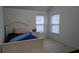 Bedroom with a twin-size bed and ample natural light at 4038 Ash Tree St, Snellville, GA 30039