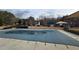 Community pool with a safety cover, promising endless fun and relaxation during the warmer months at 4038 Ash Tree St, Snellville, GA 30039