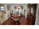 Elegant dining room boasts hardwood floors and a beautiful china cabinet at 4038 Ash Tree St, Snellville, GA 30039