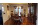 Elegant dining room boasts hardwood floors and a beautiful china cabinet at 4038 Ash Tree St, Snellville, GA 30039