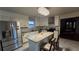 Modern kitchen with stainless steel appliances, granite island, and white cabinets at 4038 Ash Tree St, Snellville, GA 30039