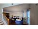 Living room with hardwood floors, blue velvet couch and a view of the staircase at 4038 Ash Tree St, Snellville, GA 30039