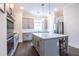 Modern kitchen with gray cabinets, quartz countertops, and stainless steel appliances at 927 Katie Kerr Dr, Decatur, GA 30030