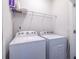 Bright laundry room with washer and dryer, and shelving at 927 Katie Kerr Dr, Decatur, GA 30030