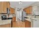 Kitchen with granite countertops and light wood cabinets at 3030 Keeneland Blvd, Mcdonough, GA 30252