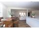 Open concept kitchen and dining area with granite countertops at 3245 Sharon Dr, Powder Springs, GA 30127