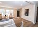 Bright living room with hardwood floors and view of staircase at 3245 Sharon Dr, Powder Springs, GA 30127