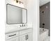 Modern bathroom with gray tile shower and white vanity at 500 Ridgewater Dr, Marietta, GA 30068