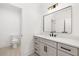 Modern bathroom with a vanity, large mirror, and toilet at 500 Ridgewater Dr, Marietta, GA 30068