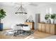 Elegant dining room with statement lighting and wood cabinets at 500 Ridgewater Dr, Marietta, GA 30068
