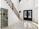 Bright entryway with statement tile floor, staircase, and wine storage at 500 Ridgewater Dr, Marietta, GA 30068