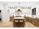 Modern kitchen with white and wood cabinets, large island, and herringbone backsplash at 500 Ridgewater Dr, Marietta, GA 30068