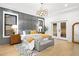 Spacious main bedroom with wood floors and gray feature wall at 500 Ridgewater Dr, Marietta, GA 30068