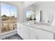 Elegant bathroom with double vanity, marble countertops, and a large mirror at 574 Bismark Ne Rd, Atlanta, GA 30324