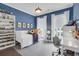 Blue-walled bedroom with large windows and a play area at 885 Stone Crest Rd, Atlanta, GA 30324