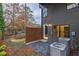 Small back patio with gravel, wooden privacy wall, and central AC units at 2323 Mason Dr # D21, Atlanta, GA 30316