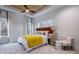 Bright bedroom with wood ceiling, large windows, and a plush yellow blanket at 2323 Mason Dr # D21, Atlanta, GA 30316