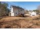 Back exterior of the house with a deck and stairs leading to the backyard at 40 Brompton Dr, Dallas, GA 30157