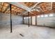 Unfinished basement with concrete floor and garage doors at 40 Brompton Dr, Dallas, GA 30157