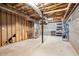 Unfinished basement with exposed beams, concrete floor, and shelving at 40 Brompton Dr, Dallas, GA 30157