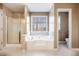 Bathroom with a shower, tub and a window that provides natural light at 40 Brompton Dr, Dallas, GA 30157