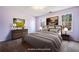 Staged bedroom with neutral gray color, art and plenty of light at 40 Brompton Dr, Dallas, GA 30157