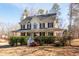 Two-story house with wraparound porch and landscaped yard at 40 Brompton Dr, Dallas, GA 30157