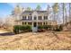 Two-story house with wraparound porch and manicured lawn at 40 Brompton Dr, Dallas, GA 30157