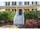 Front entrance with stairs and American flag at 40 Brompton Dr, Dallas, GA 30157