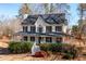 Charming two-story home with a welcoming front porch and manicured landscaping at 40 Brompton Dr, Dallas, GA 30157