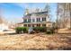 Charming two-story home with a welcoming front porch and manicured landscaping at 40 Brompton Dr, Dallas, GA 30157