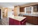 Bright kitchen features an island, window with natural light and stainless steel dishwasher at 40 Brompton Dr, Dallas, GA 30157