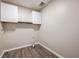 Laundry room with white cabinets and vinyl flooring at 40 Brompton Dr, Dallas, GA 30157