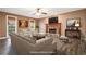 Staged living room with stone fireplace, wooden mantle, and neutral furnishings at 40 Brompton Dr, Dallas, GA 30157