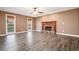 Bright living room with stone fireplace, hardwood floors, and natural lighting at 40 Brompton Dr, Dallas, GA 30157