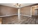 Open living room featuring hardwood floors and neutral paint at 40 Brompton Dr, Dallas, GA 30157