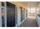 Front porch with black door and white railing at 40 Brompton Dr, Dallas, GA 30157