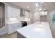 Bright kitchen featuring white cabinets, quartz countertops, and a large island at 510 Winston Croft Cir # 56, Johns Creek, GA 30022