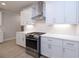 Stainless steel appliances and white shaker cabinets in this kitchen at 510 Winston Croft Cir # 56, Johns Creek, GA 30022