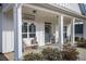 Charming front porch features a bench and decorative sign at 104 Whitley Ct, Dallas, GA 30157