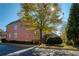 Beautiful brick home featuring manicured landscaping and a serene street view with mature trees at 11644 Parkside Ave, Alpharetta, GA 30005